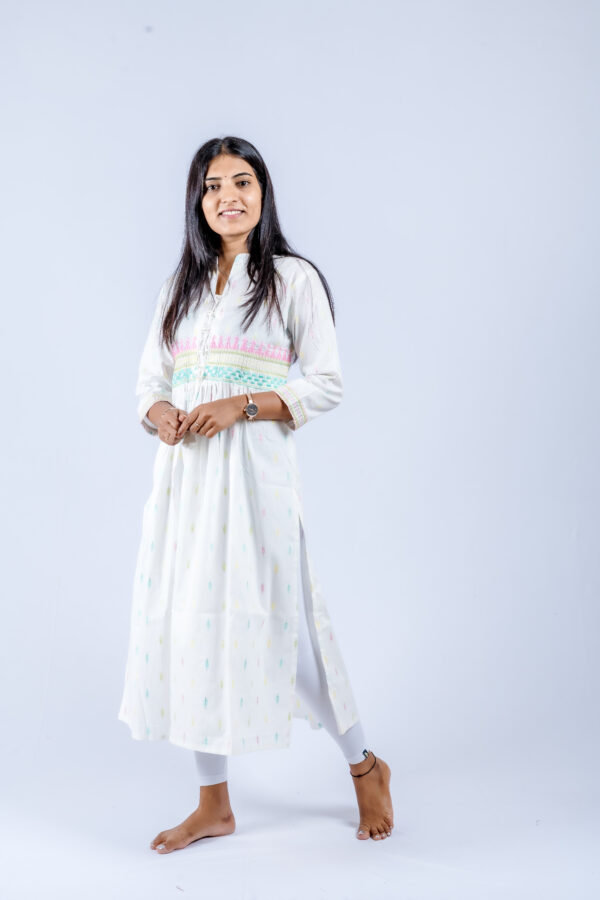 White floral threadwork on the yoke